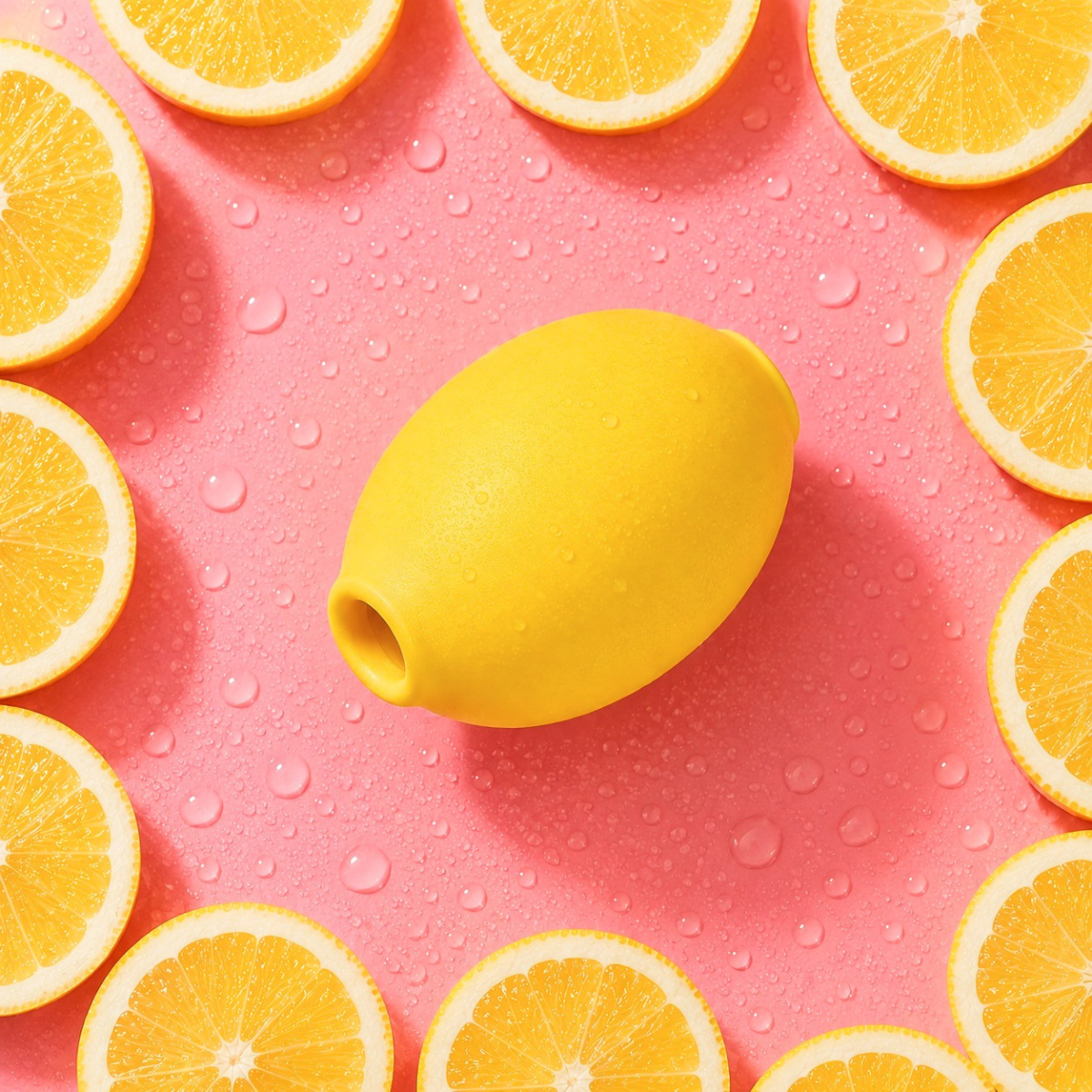 Lemon Calm Device on a pink background with fresh lemons